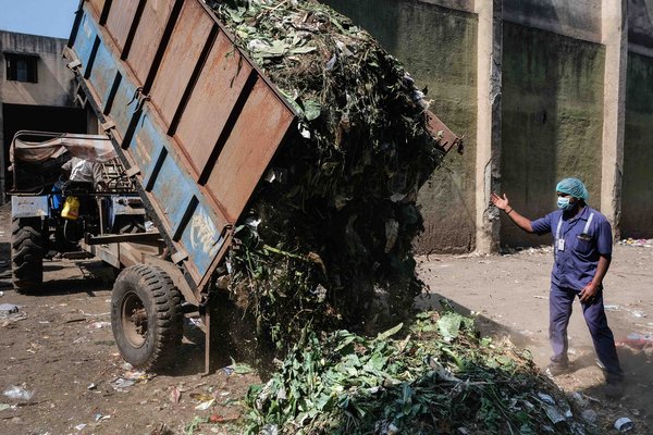 A lorryload of organic waste from close by the city arrives at the waste treatment plant in Nashik.